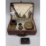 Suitcase with interesting Curios to include a tortoiseshell music box and miscellaneous figures