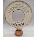 A vintage original cast steel bus stop sign of local history, reads "HAMPSHIRE, HURN" 38cm diameter,