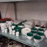 A Denby tea set other storage jars for tea, coffee and sugar.