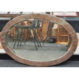 Vintage oval copper framed mirror with bevelled edged glass 84x60cm.
