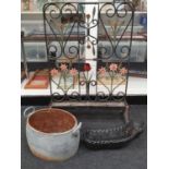 Wrought iron decorative flower trough together with a twin handled cooking pot and a small planter.