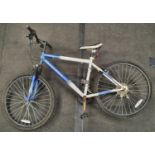 Blue and white Muddyfox Turbulent mountain bike 18" frame size.