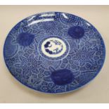 An oriental blue and white pottery plate 29cm diameter.