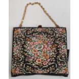 A ladies possibly 1930's handbag/purse with floral decorative lacework to front and reverse.