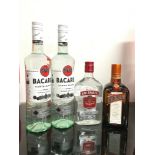 Four bottles of alcohol: 2 x Bacardi White Rum 70cl, Smirnoff Vodka 35cl, Cointreau 50cl. Ref 303/