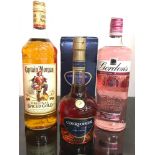 Three bottles of alcohol: Captain Morgan Spiced Rum 1L, Gordon?s Pink Gin 70cl, Courvoisier VSOP