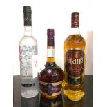 Three bottles of alcohol: Grant?s Scotch Whisky 1L, French Grain Vodka 70cl, Courvoisier VS Cognac