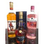 Three bottles of alcohol: Captain Morgan Spiced Rum 1L, Gordon?s Pink Gin 70cl, Courvoisier VSOP