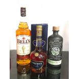 Three bottles of alcohol: Bell?s Scotch Whisky 1L, Poetic License Northern Dry Gin 70cl, Courvoisier