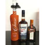 Three bottles of alcohol: Chase Marmalade Vodka 70cl, Lamb?s Navy Rum 70cl, Cointreau 50cl. Ref