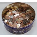 Purple tin of mixed coinage.