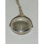 Vintage Bright silver spinning locket.