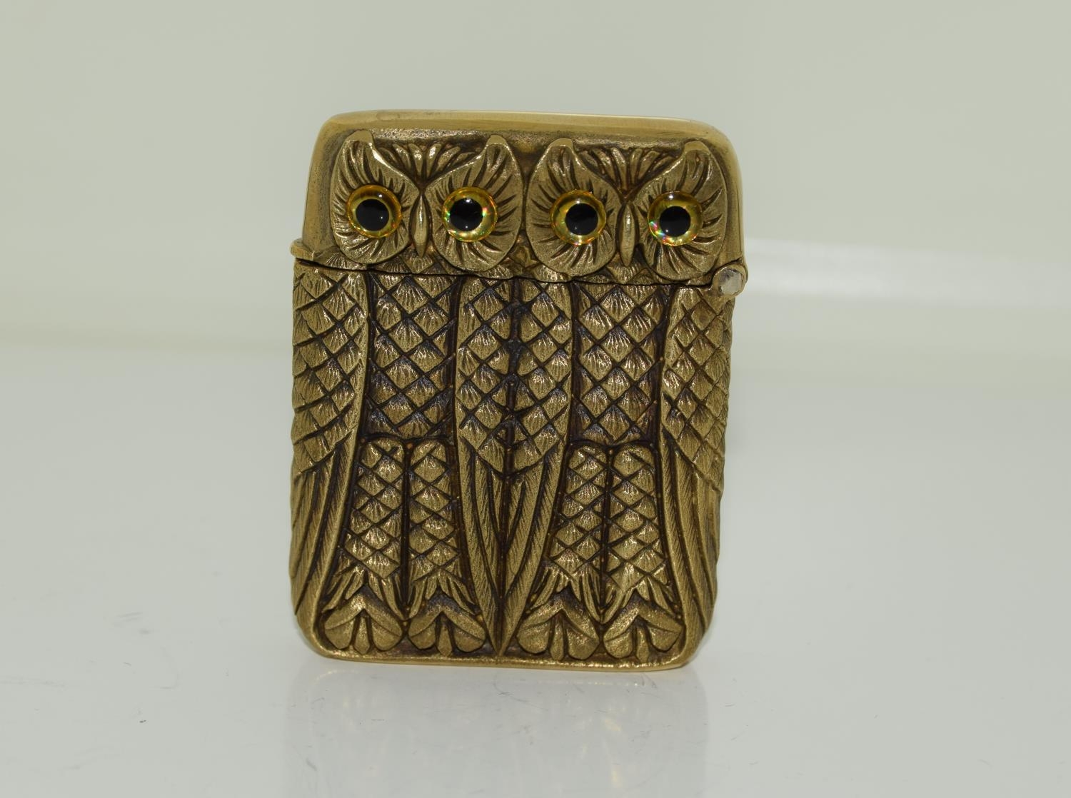 A brass cased double owl vesta case.