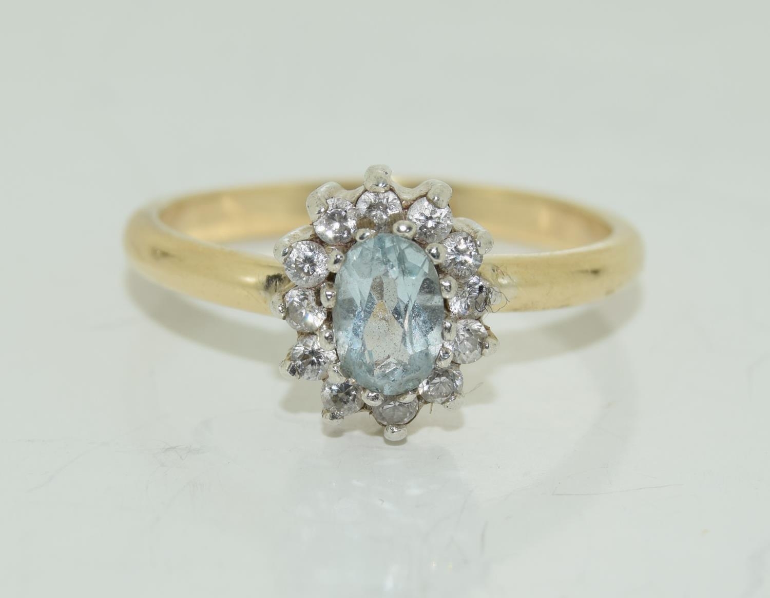 Aquamarine gold on silver cluster ring, Size Q 1/2.