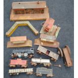 Box of tinplate O gauge railway items to include a locomotive in poor condition.