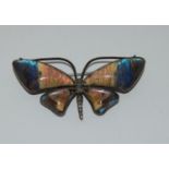 A sterling silver butterfly wing brooch.