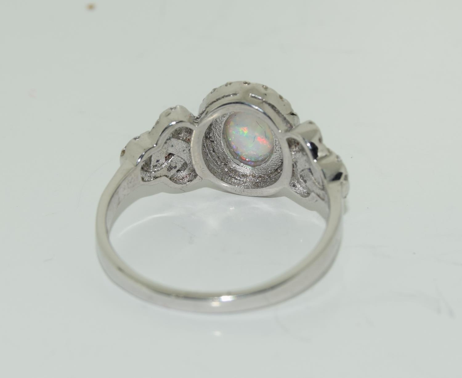 A silver CZ and opal paneled Art Deco style ring. - Image 3 of 3