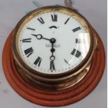Brass Bulkhead clock with key.