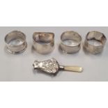 4 silver napkin rings together a baby rattle