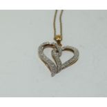 0.25ct Diamond and gold on silver heart pendant.