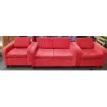 From a hotel clearance: Two armchairs and a two seater sofa in red.