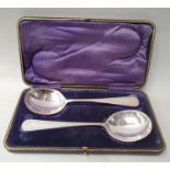 Set of silver soup ladles in fitted case.