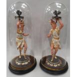 Pair of glass dome Egyptian figures.