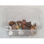 Clear plastic tub of various coinage.