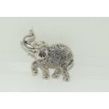 Silver elephant brooch.