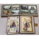 Victorian musical photo album together with an album of early colour and black and white postcards.