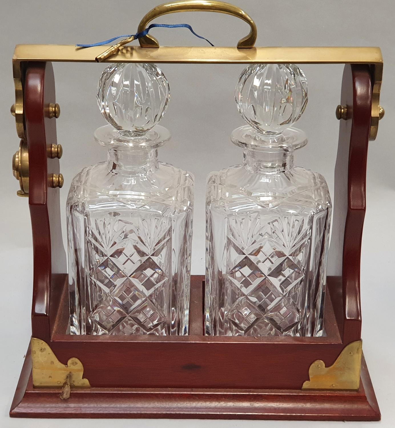 A pair of crystal cut glass decanters in tantalus with key. - Image 4 of 5