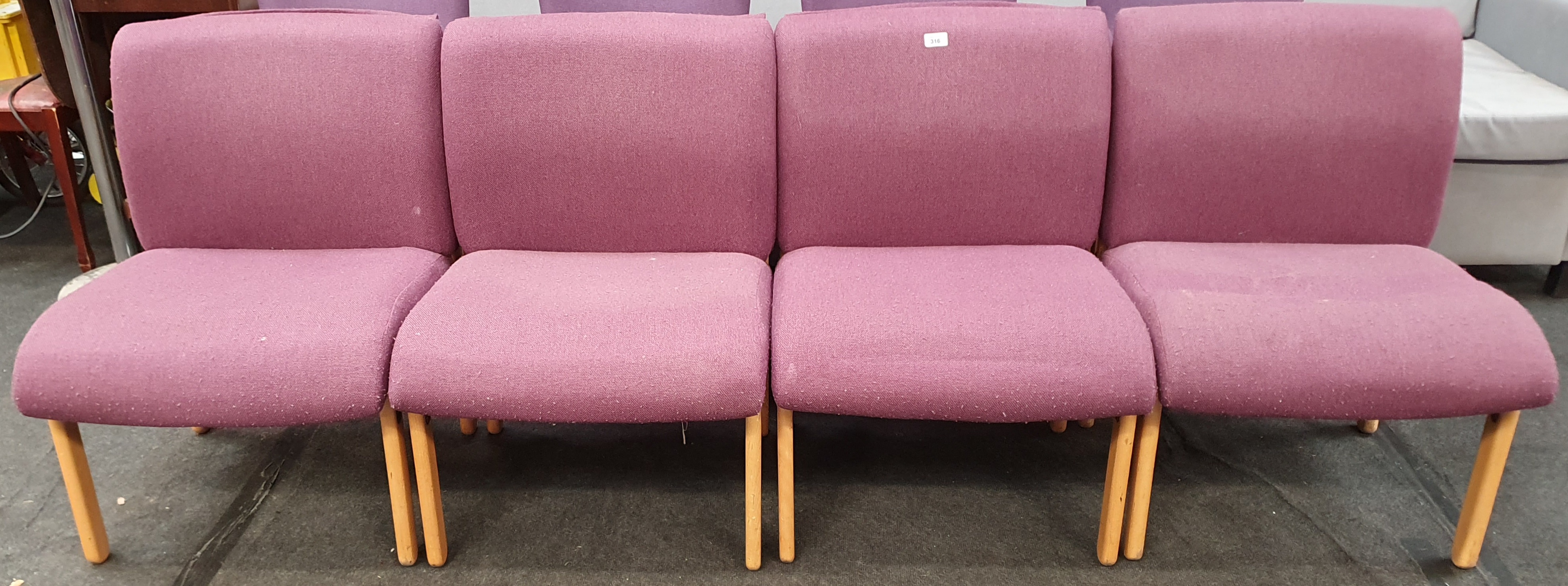 From a hotel clearance: Four lobby chairs in mauve.