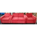 From a hotel clearance: Two armchairs and a two seater sofa in red.