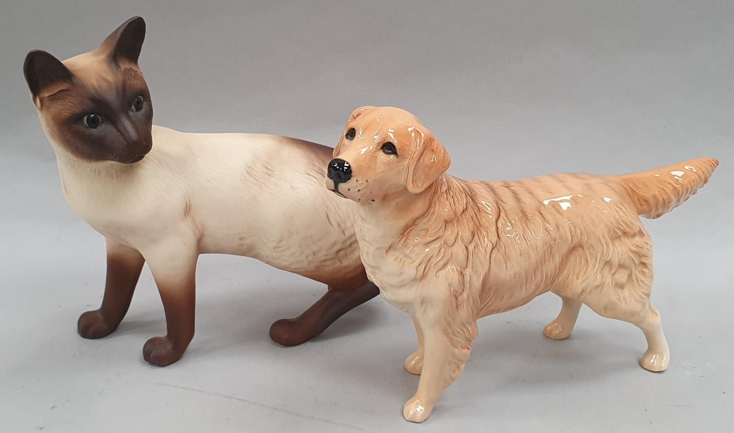 Two Beswick animals: Golden Retriever and Persian Cat.