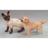 Two Beswick animals: Golden Retriever and Persian Cat.