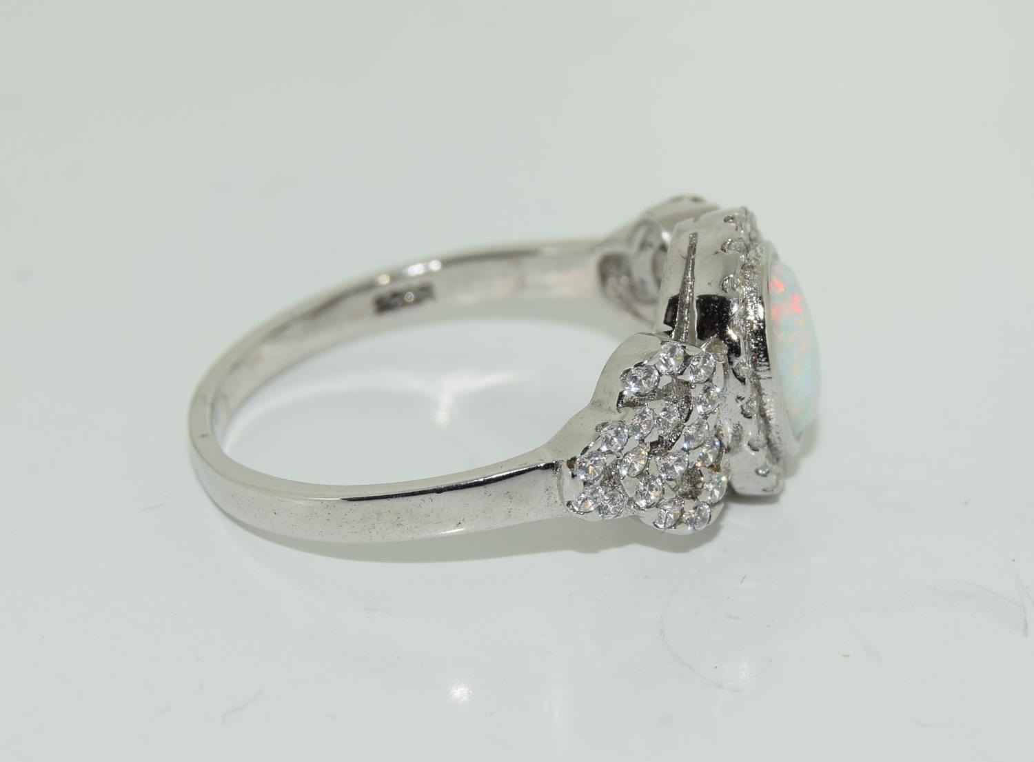 A silver CZ and opal paneled Art Deco style ring. - Image 2 of 3