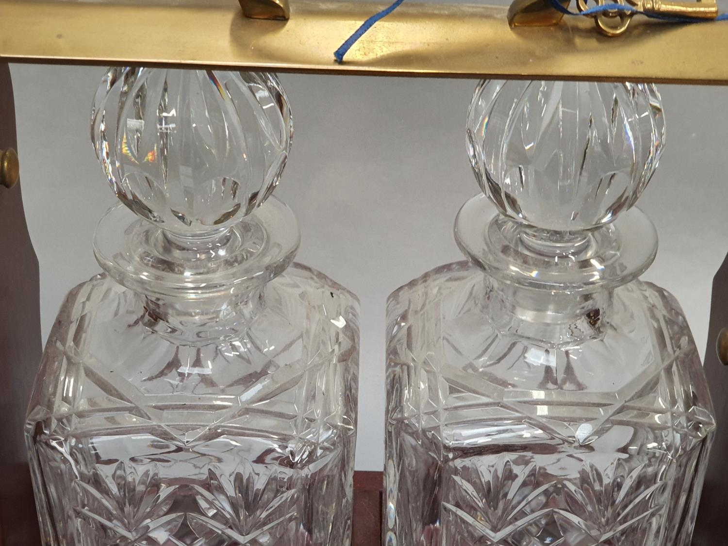 A pair of crystal cut glass decanters in tantalus with key. - Image 2 of 5