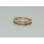 A Diamond 1/2 eternity ring, 11 diamonds total 0.50ct set in 9ct gold ring, size L+