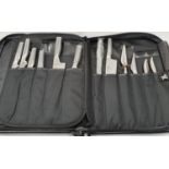 A cased set of 12 Global kitchen knives.