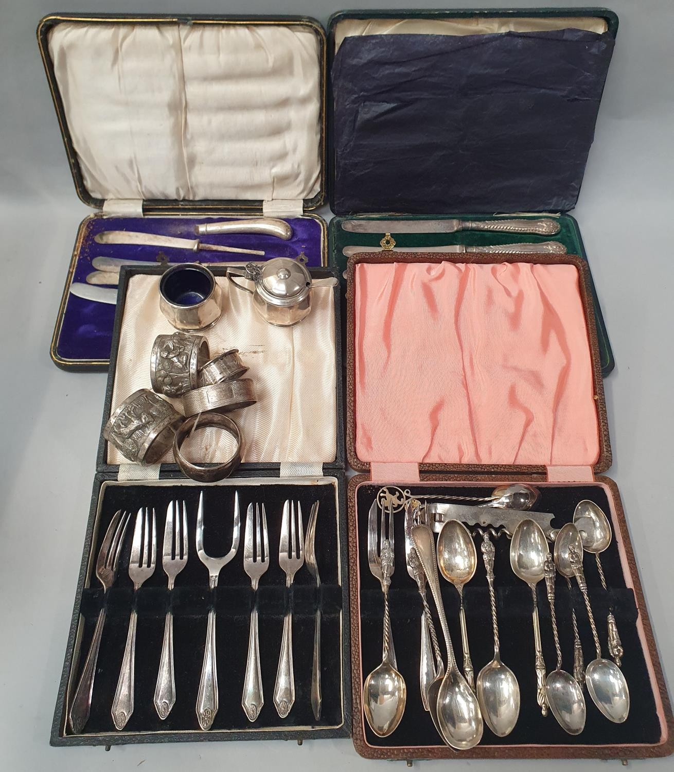 Boxed flatware and silver napkin rings and other misc silver.