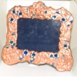 A copper and enamel art nouveau style picture frame.
