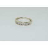 A 9ct gold and Diamond 7 stone 1/2 eternity ring, Size N+