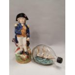 Character jug of Nelson together with a ship in a bottle.