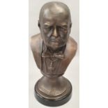 A cast metal bust of Winston Churchill on metal base 33cm tall.