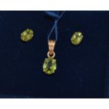 14ct gold ladies Peridot earrings together with a matching pendant