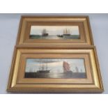 A pair of gilt framed oil on board paintings of ships at sea, each 39.5x22cm.