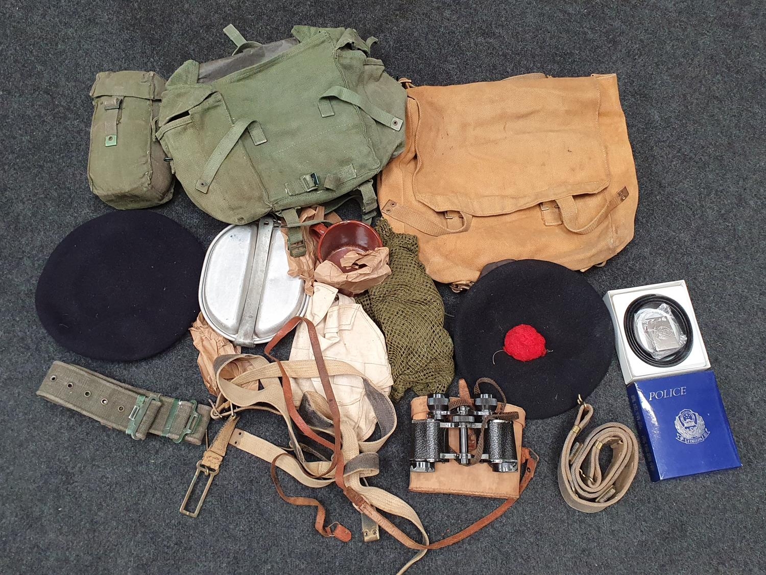 Collection of military surplus and clothing.