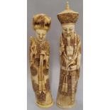 A pair of ivory coloured oriental figures 32 and 29cm high.