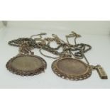 Large pendant necklaces holding Victorian and Elizabeth crowns together with other silver chains