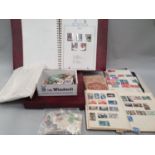 Queen Elizabeth II stamp album another album and loose stamps.